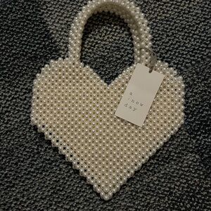 A New Day Pearl Heart Bag